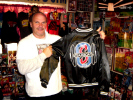 George holds a jacket from Ricky Steamboat's Gym
